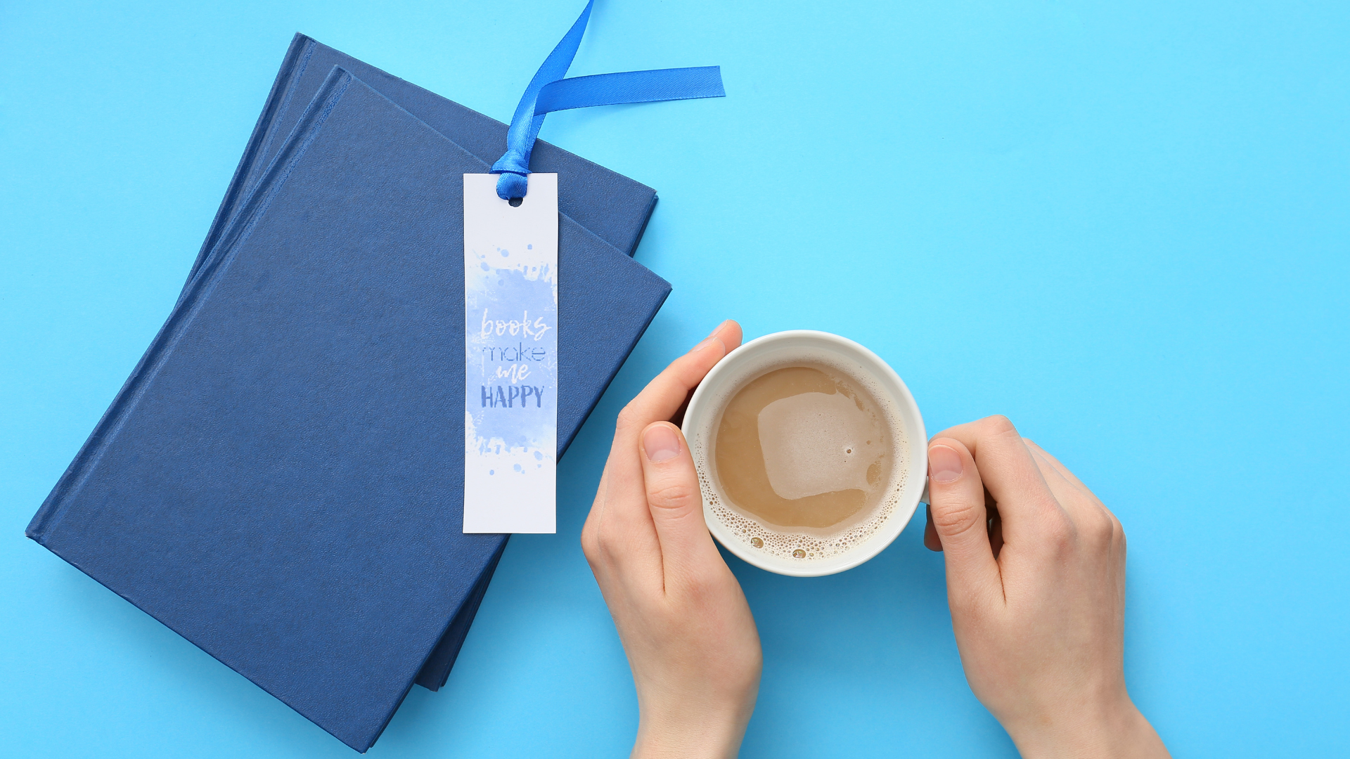 Image for the Books, Brews & Bookmarks event at Georgette's Studio featuring a handmade bookmark, stacked books, and a cup of coffee.